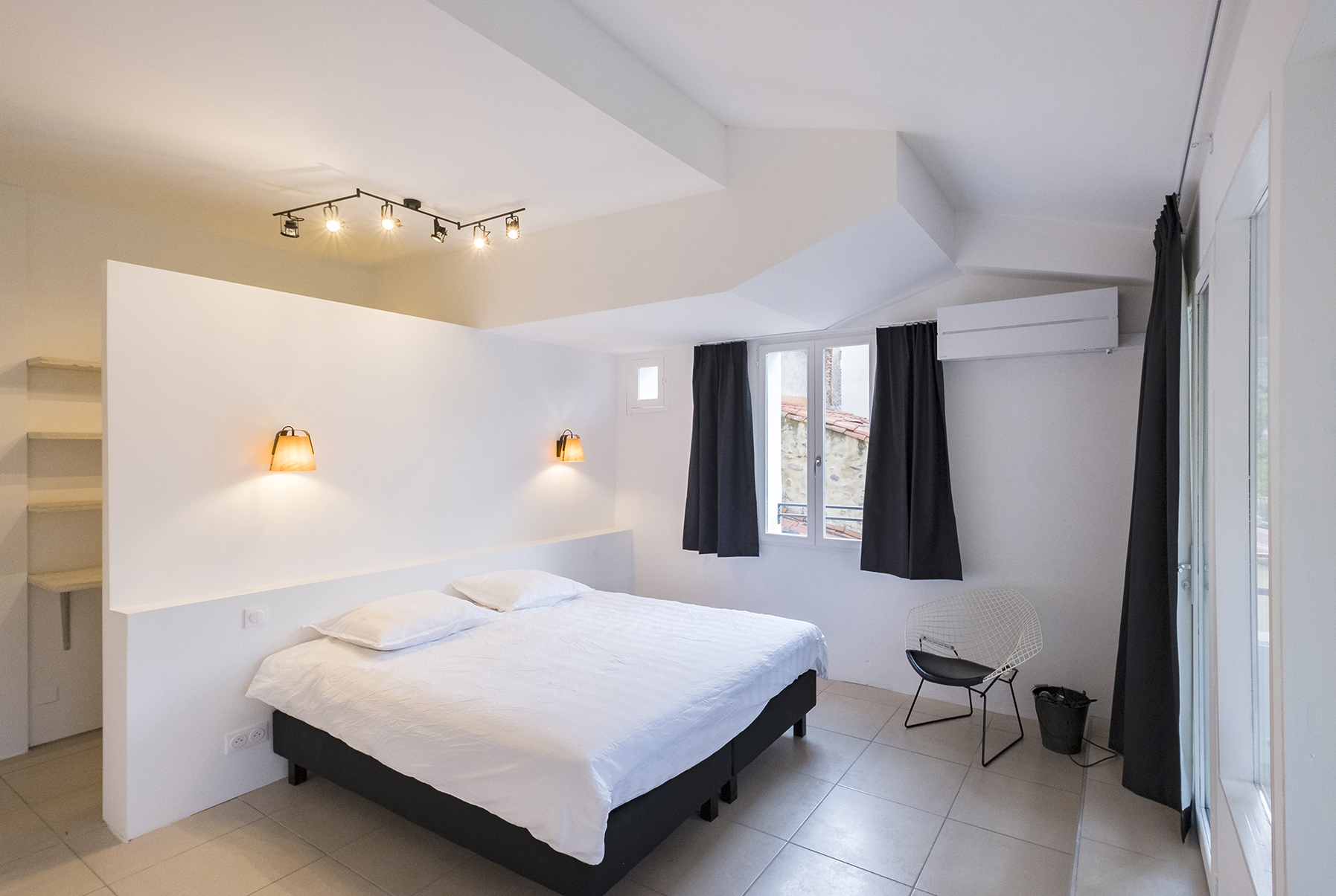 Slaapkamer van Duplex 77 met tweepersoonsbed